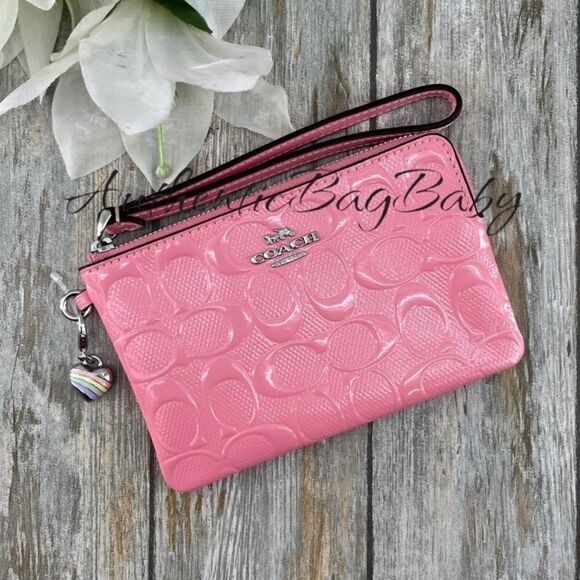 Coach Handbags - Coach Corner Zip Wristlet In Signature Leather With Heart Charm Wallet